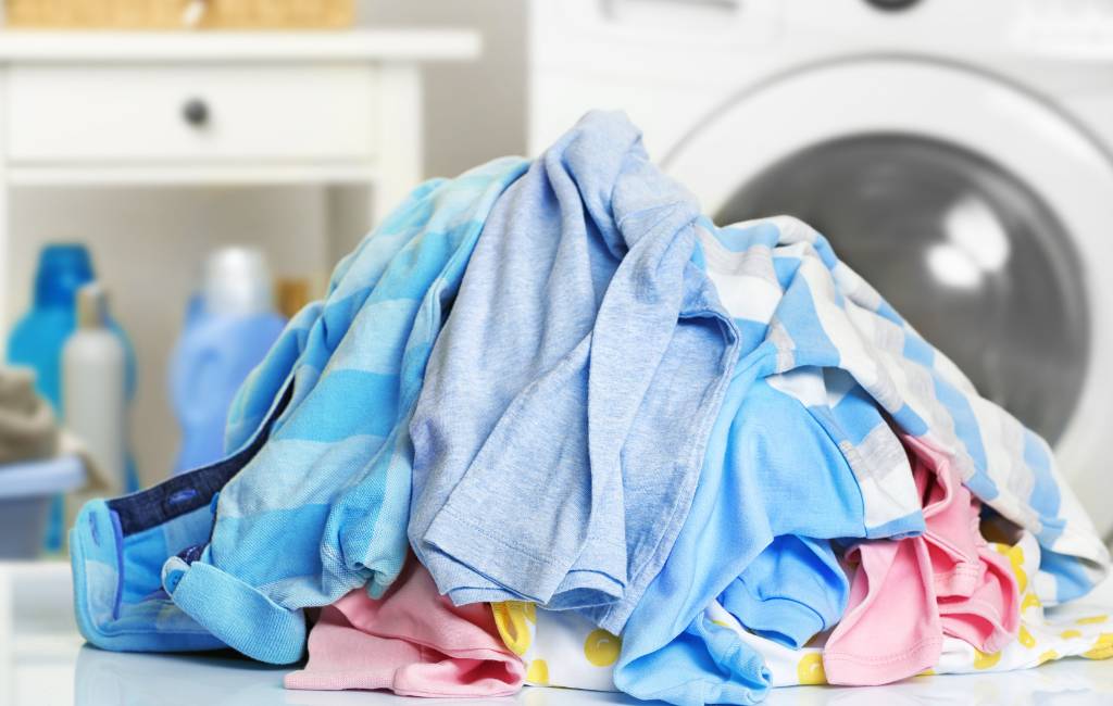 Laundry Service that Makes Life Easier in Lafayette, IN | Laundry Care large pile of colorful clean laundry
