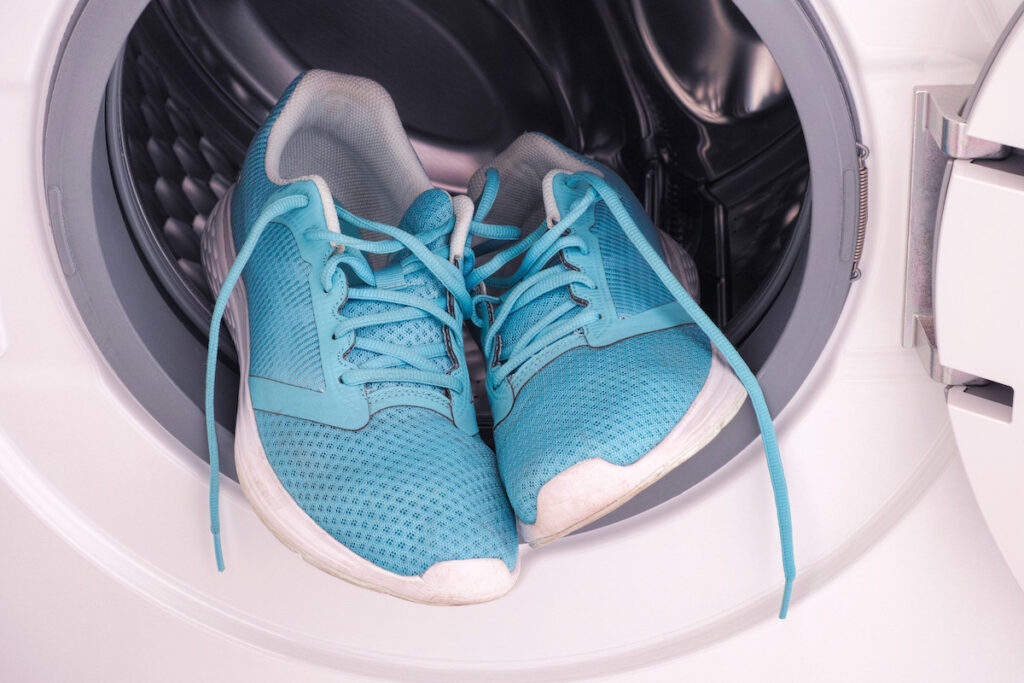 How to Clean Your Sneakers | Laundry Care Blue athletic shoes in washing machine